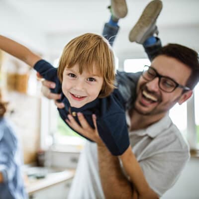 Dad playing with son