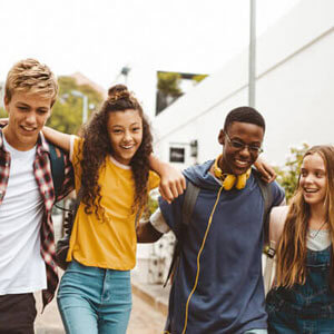 teens walking arms on shoulders px - Alive and Free Chiropractic